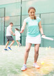 © JackF - Emotional young adult woman training padel at warm sunny day