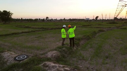 Wall Mural - 4k vdo, two engineers working inspections at the electric power station to view the planning work by