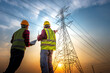 © เลิศลักษณ์ ทิพชัย - Two electrical engineers stand at the power station to look at the power generation planning work at the high voltage terminals.