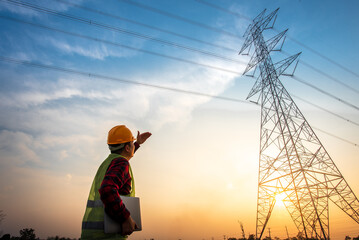 Sticker - electrical engineer working at the power station See the planning of electricity production at high voltage poles.