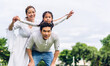 © Art_Photo - Portrait of enjoy happy love asian family father and mother holding cute little asian girl child smiling playing and having fun moments good time in summer park at home