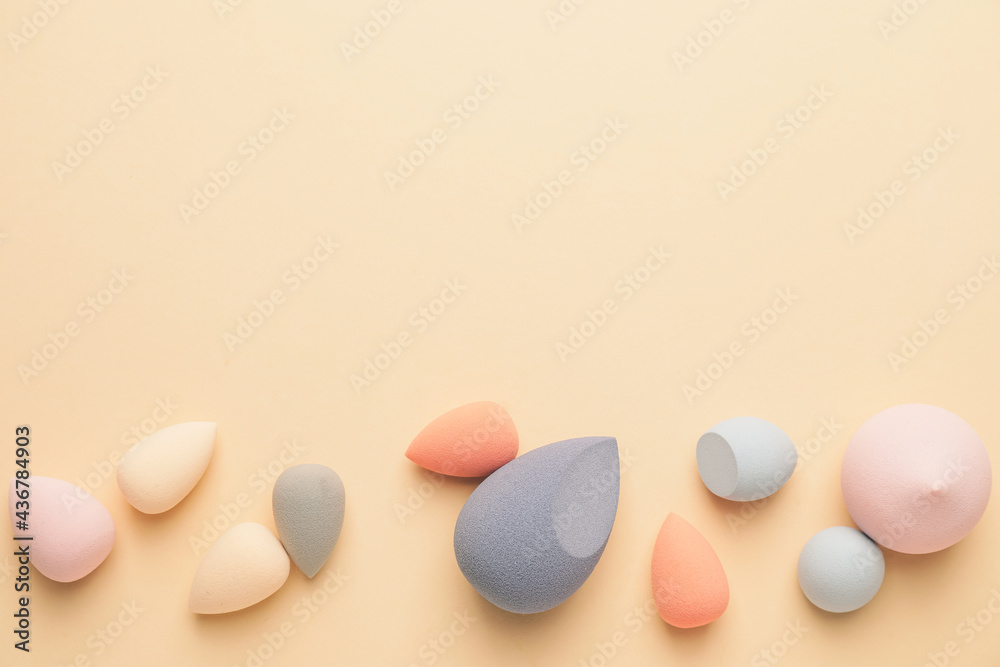 Makeup sponges on color background