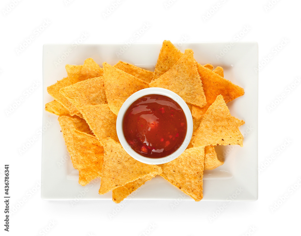 Plate with tasty nachos and sauce on white background
