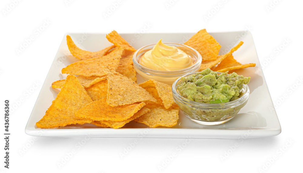 Plate with tasty nachos and sauces on white background