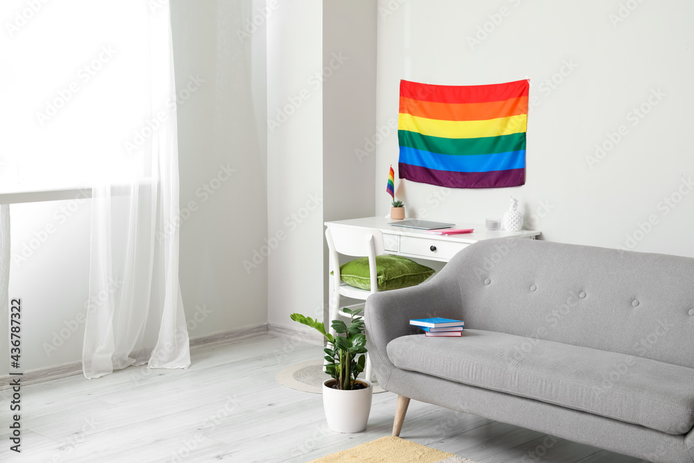 Sofa and flag of LGBT in interior of living room - obrazy, fototapety, plakaty 