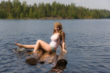 Cheerful Girl Sitting On A Raft