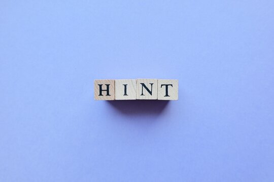 'HINT' word, made from wooden blocks