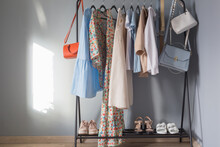 Light Colored Womens Summer Clothes And Shoes On  Hanger