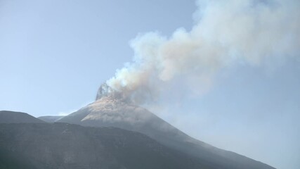 Wall Mural - timelapse eruption of smoke, steam and gas from South-East crater of Etna Volcano in Sicily during the volcanic activity of 28 may 2021