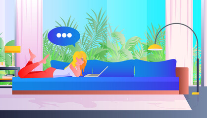 Poster - woman lying on sofa and using laptop chat bubble communication social media network concept