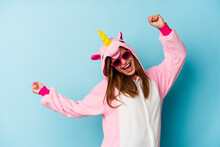 Young Woman Wearing An Unicorn Costume With Sunglasses Isolated