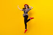 © deagreez - Full length body size view of charming chic cheerful girl jumping having fun good mood isolated over bright yellow color background
