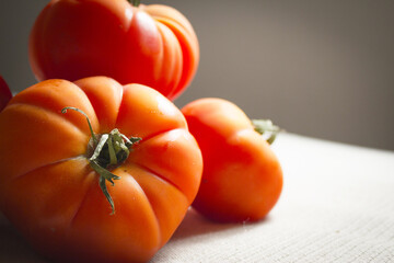 Group of uncooked raw red tomatoes