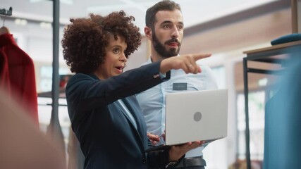 Wall Mural - Clothing Store: Businesswoman Uses Tablet Computer, Talks to Visual Merchandising Specialist, Collaborate To Create Stylish Collection. Small Business Fashion Shop Sales Manager Talks to Designer.