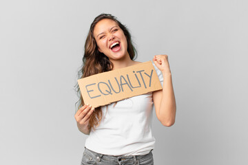 Wall Mural - young pretty woman holding a equality banner