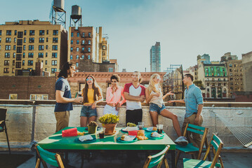 Group of friends having party on a rooftop