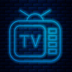 Wall Mural - Glowing neon line Retro tv icon isolated on brick wall background. Television sign. Vector