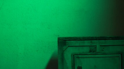 Sticker - A footage of an old locker in front of a green wall