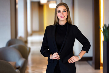 Beautiful young adult lawyer business woman professional in a suit at the attorney law offices