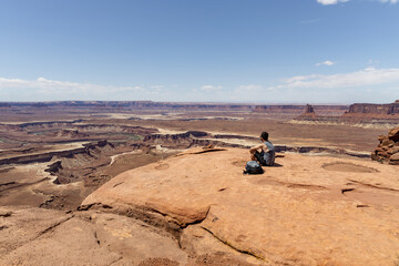 Relaxing during a hike on top of a canyon 