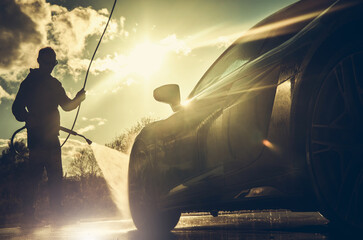 Sticker - Driver Power Washing His Performance Car During Sunset