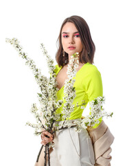 Wall Mural - Beautiful young woman with blooming spring branches on white background