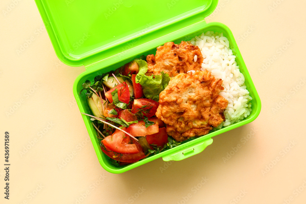 Lunch box with tasty food on color background