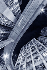 Wall Mural - Elevated road through residential building in Hong Kong city.