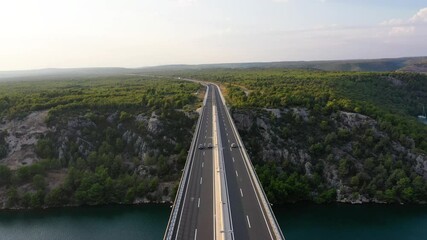 Wall Mural - aerial view on road. highway through mountain valley. view from a drone. natural landscape in summer