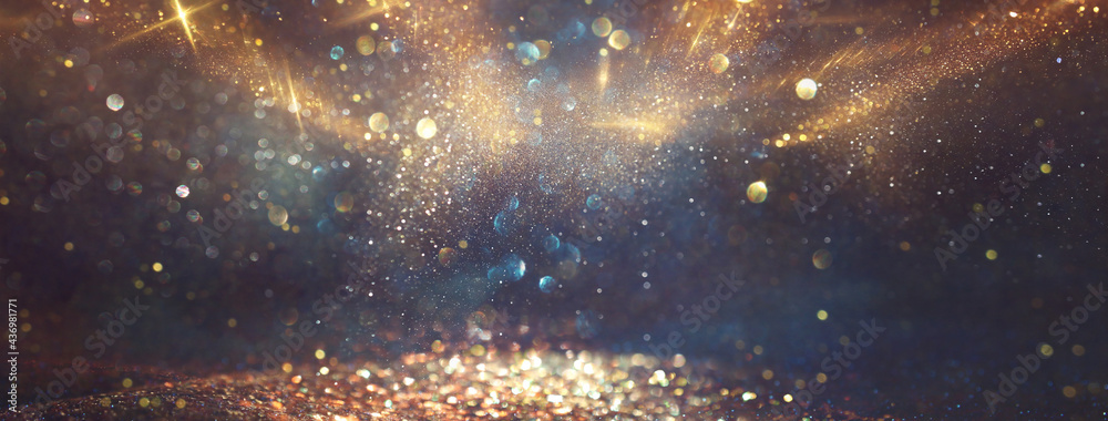background of abstract glitter lights. gold, blue and black. de focused - obrazy, fototapety, plakaty 