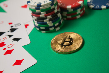 Classic playing cards, chips, bitcoin and dollars on green background. Gambling and casino concept.