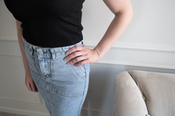 Portrait of a woman in a denim skirt