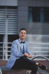 Canvas Print - Handsome male with a suit posing outdoors