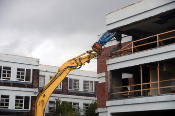 demolishing the old building