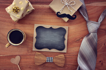 Wall Mural - top view image of fathers day composition with vintage father's accessories and blackboard