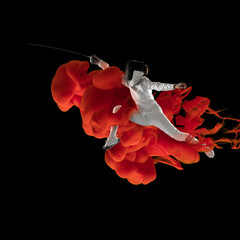 Wall Mural - Collage of athlete, female swordsman in explosion of colored neon red smoke fluid isolated on black background.