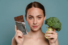 Half-naked Ginger Woman With Pimples Posing With Chocolate And Broccoli