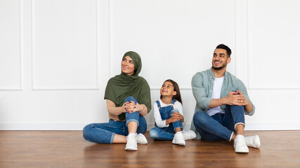 Poster - happy man, woman and girl looking aside at home