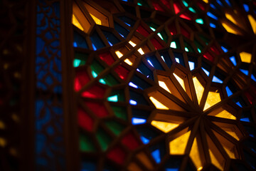 Photo of colored stained glass with colored light