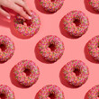 Donuts seamless pattern on pink background