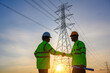 © เลิศลักษณ์ ทิพชัย - Electrical engineer with workers Talk to each other and shake hands to agree on the production of electric power. Planned by producing power at the high voltage electrodes.