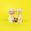 The concept of the Prade lgbt pride festival. Two David sculptural heads with sunglasses and a rainbow heart