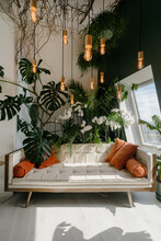 Couch And Green Plants In Cozy Living Room