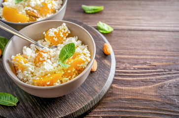Wall Mural - Cottage cheese with almonds and peaches for breakfast