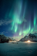 Wall Mural - aurora borealis, northern lights with stars glowing on snowy mountain in the night sky on winter at 