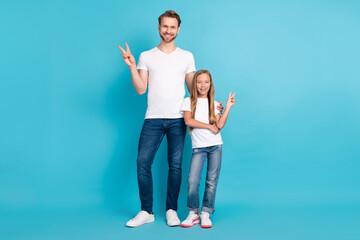 Wall Mural - Full size portrait of handsome guy cute girl standing fingers show v-sign isolated on blue color background