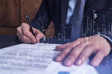 Wall Mural - A client in formal wear is signing the contract to invest money in stock market. Internet trading and wealth management concept. Forex and financial hologram chart over the desk.