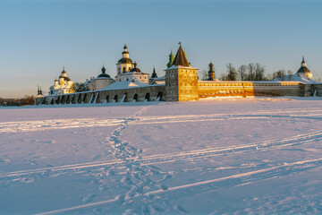 View of the Kirillo-Belozersky Monastery from the Seversky Lake in the rays of the rising sun on a frosty winter morning, Kirillov, Vologda region, Russia