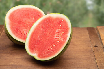 Watermelon picked and sliced in half on a table at the farm