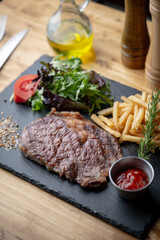 Sticker - beef steak with salad and french fries